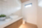 washroom with wooden items
