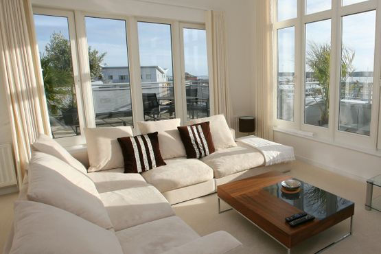 house interior with sunlight coming through glass windows
