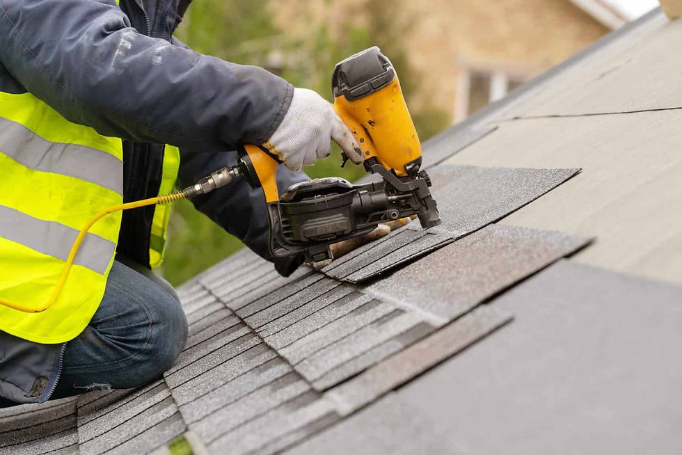 Photo of a roofer laying a roof