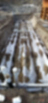 pipes laid out in a big pit