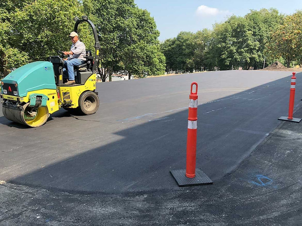 man repairing the asphalt road