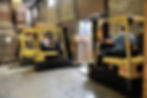 Multiple workers at a warehouse with boxes ready for shipment