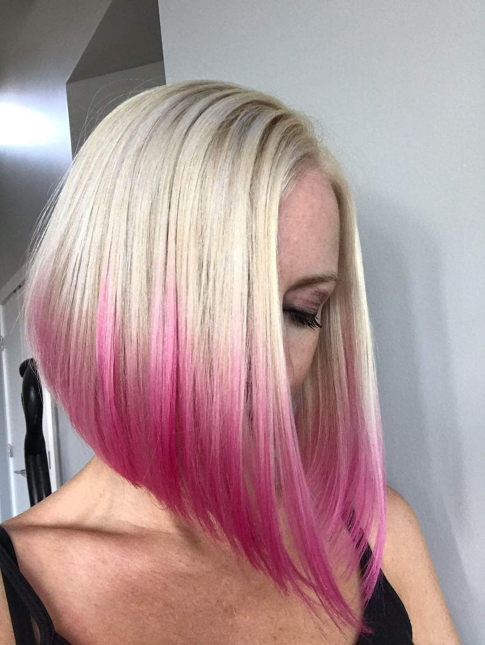 Medium length woman hair after styling and colouring