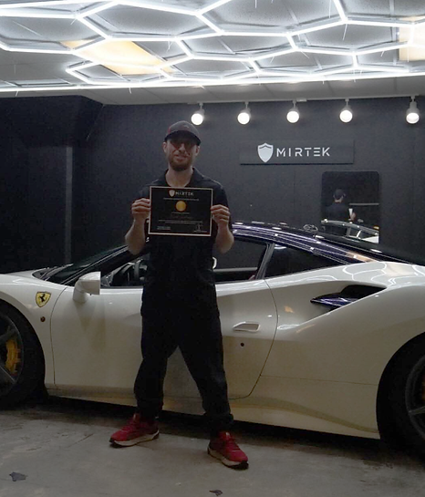 Person holding a ferrari certificate