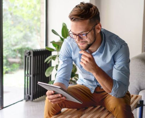 Young Man looking at digital tablet