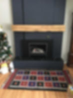 a fireplace built in a completely black wall