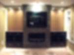 wall with inbuilt TV cabinet and a fireplace