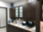 Side view of a room with stationary and cabinets