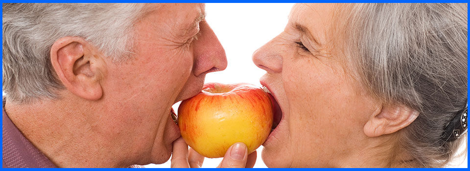 Strong and natural-looking dentures used on an apple