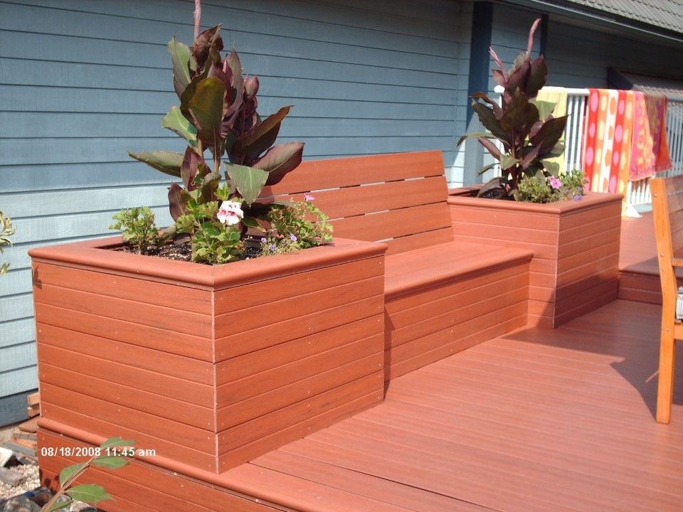 Close view of a patio seats and decorative plants on either side of the seat