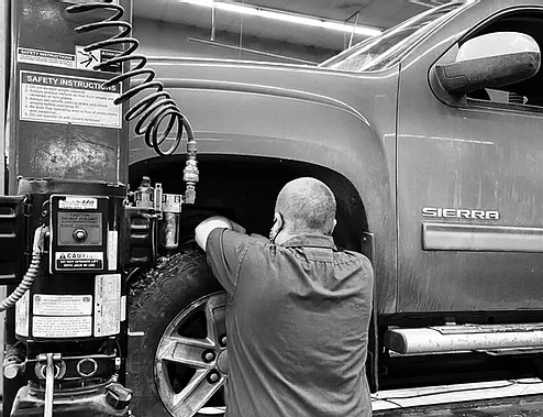 James working on a car
