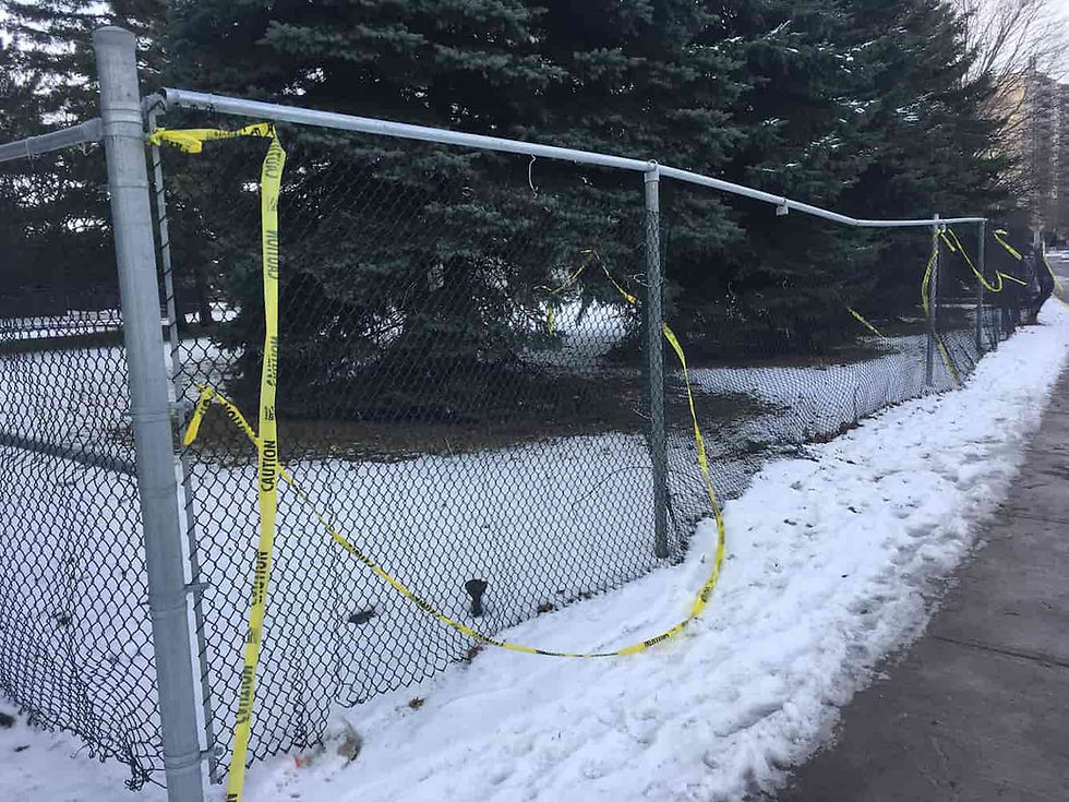 Broken chain-link fence that needs repair