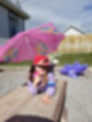 girl posing with umbrella in sunny day