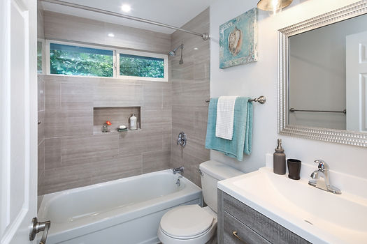 close up of a newly renovated bathtub and shower