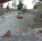 excavator digging a mountain