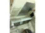 man installing commercial kitchen chimney