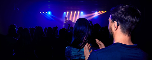 Man with hearing aid at concert