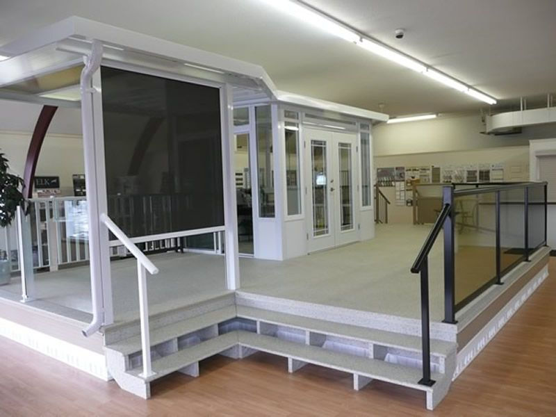 Furnished interior of a building with darks screen, railing and doors