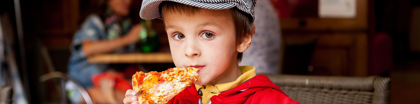 boy eating pizza