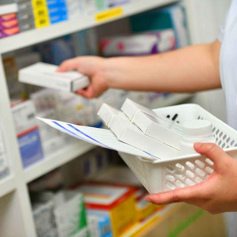 Pharmacist putting the medicine on shelf