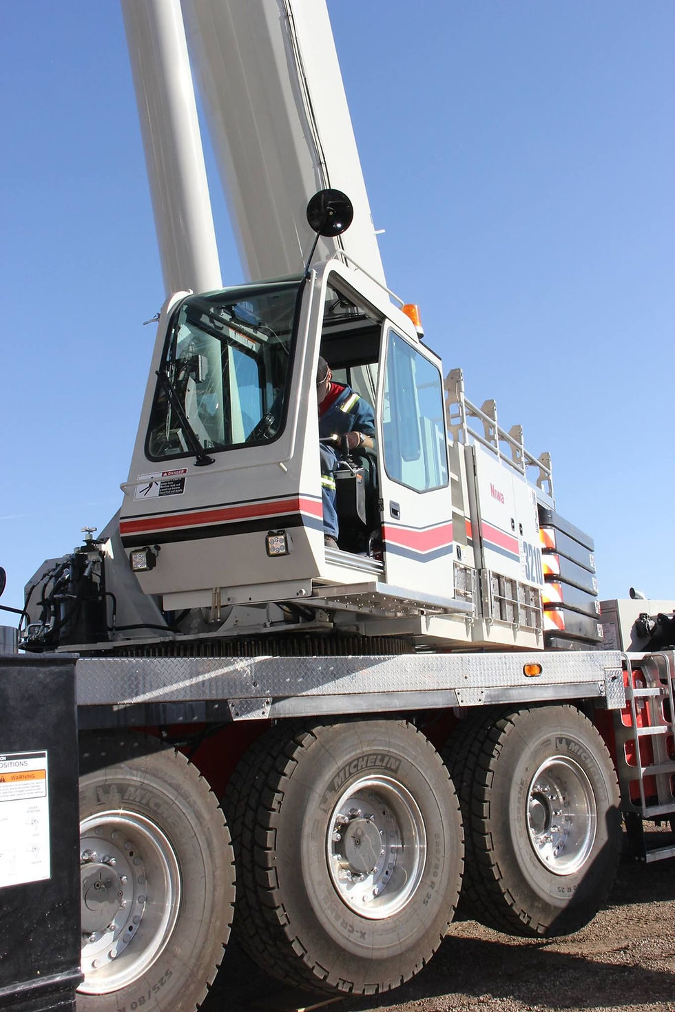 a photo of an engineer controlling the crane
