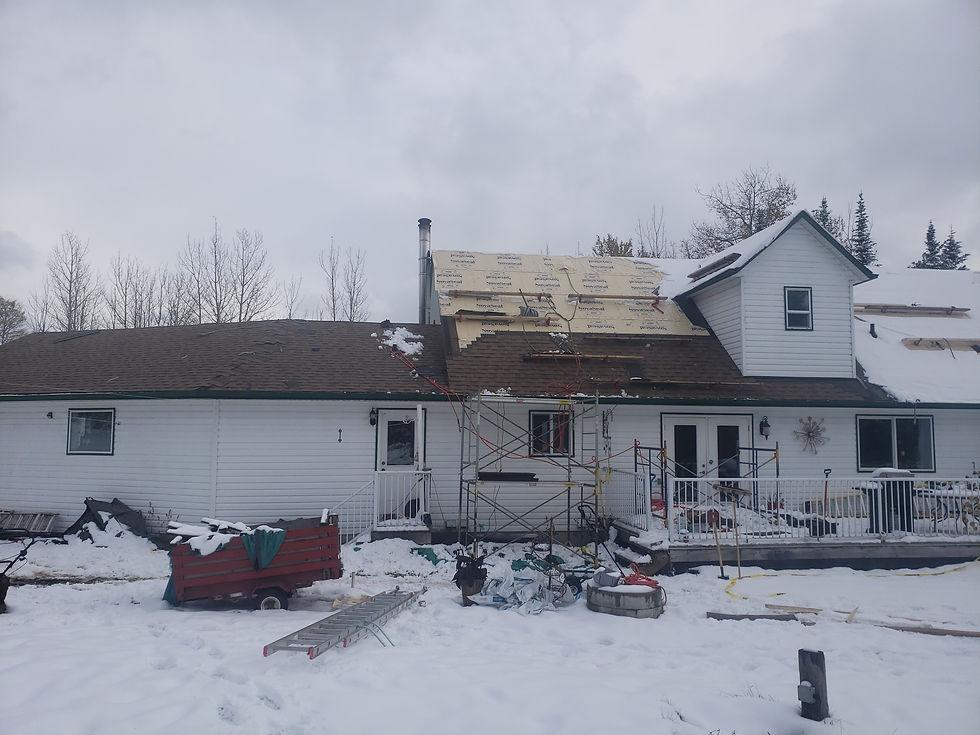 View of house under construction in snow