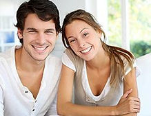 smiling young couple at home