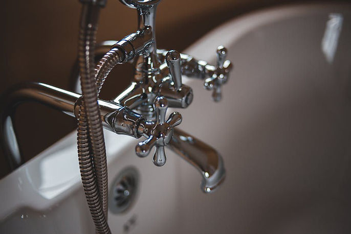 A of a silver shower faucet.