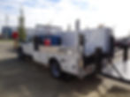 Side view of Customized white truck with welding deck