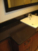 bathroom countertop with wash basin