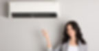 woman with remote control heating & air conditioning unit