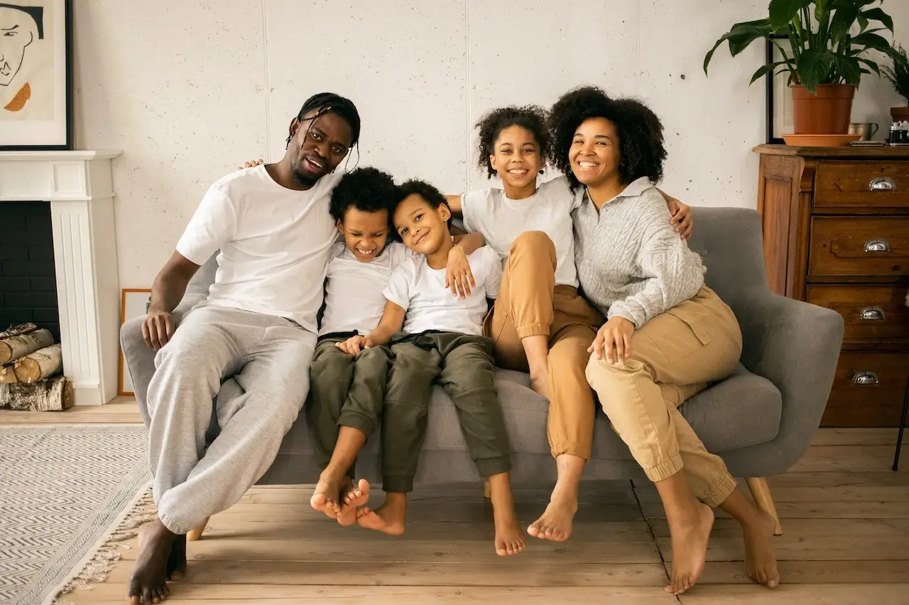 happy family sitting on the couch