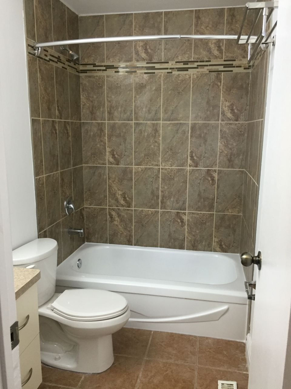 toilet seat alongside a bathtub