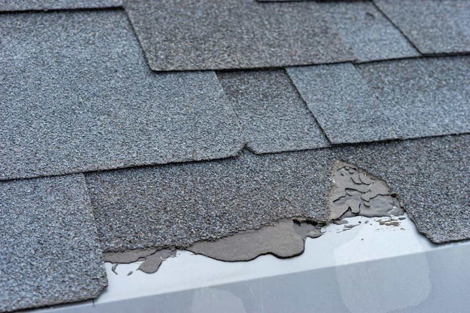 Close up view of shingles roof damage
