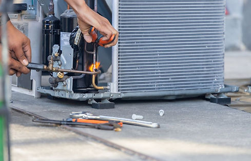 Air conditioner being repaired