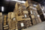 Low angle view of packed boxes on pallets in a warehouse