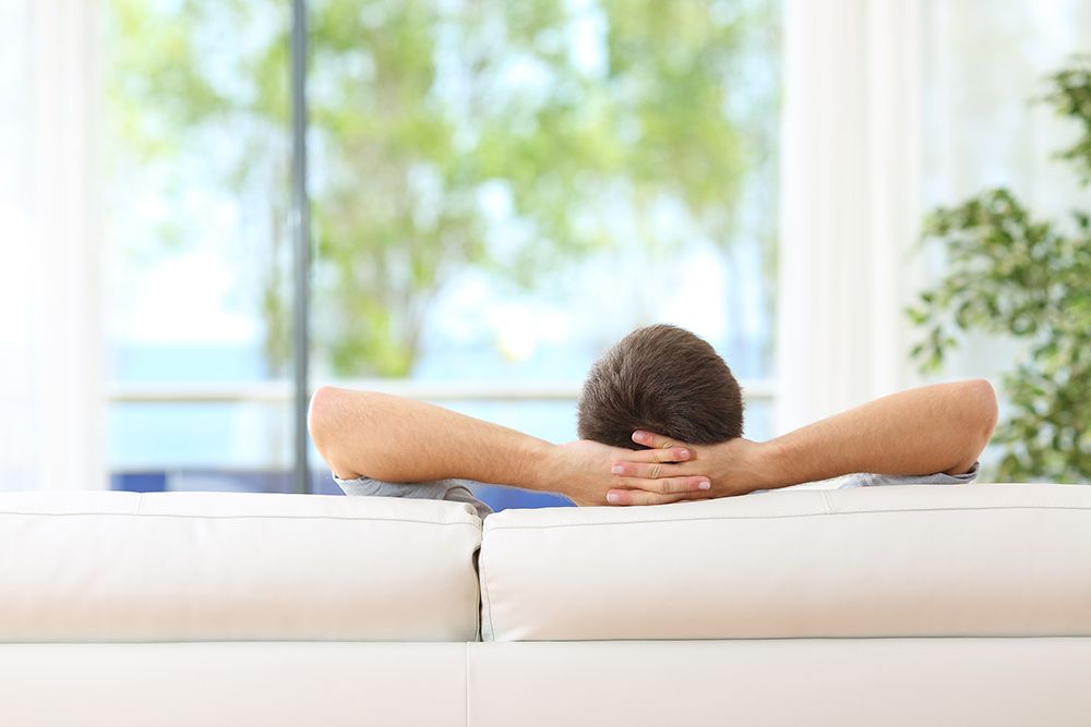 Man relaxing on sofa