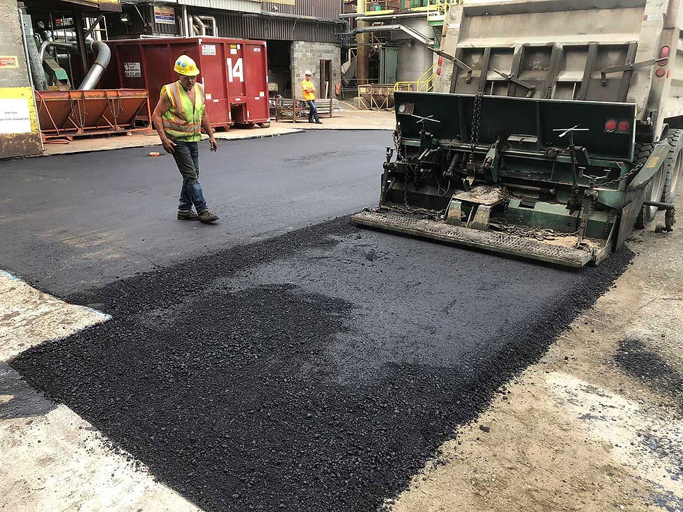 asphalt spreader in work on site