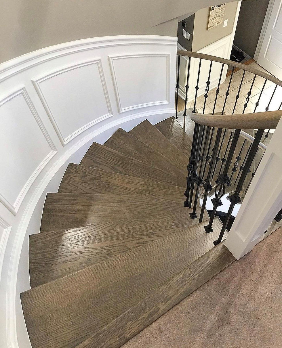 round stairway with wooden flooring