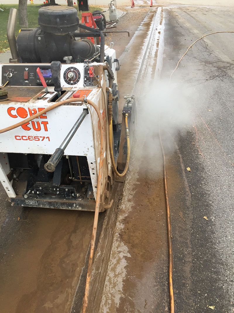Road saw cutting road