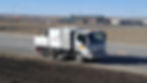 Sweeping truck cleaning a highway