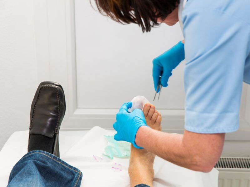 Doctor working on toe nail