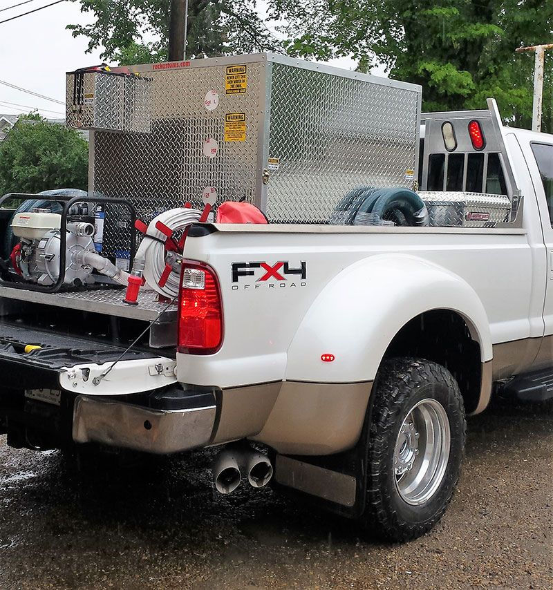Portabel fire skid units on back of truck bed