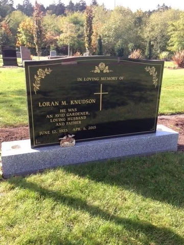 Headstone reads: