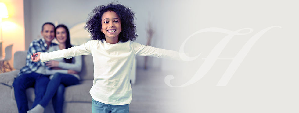 Happy young girl stands before her family