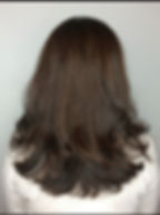 image of a woman with dark styled hairs