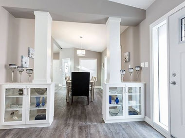 wide angle view of dinning table and cabinets in the house