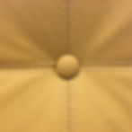 button at the center of a fabric