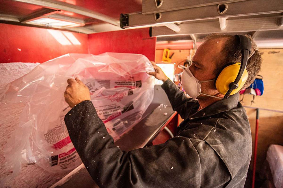 man working with insulation material