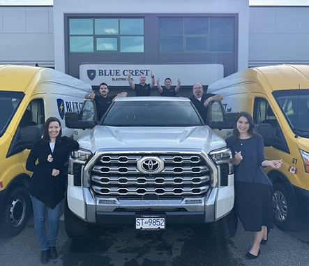 team in front of truck